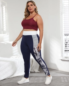 Detail of plus size cropped tank top and side-striped leggings for athletic wear