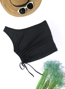 Detail of one-shoulder black crop top with adjustable side drawstring and ribbed fabric