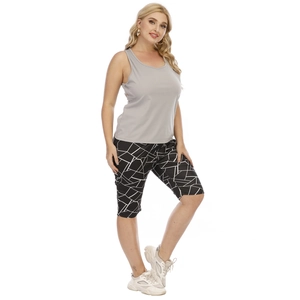 Detail showing the gray racerback tank top and geometric print high-waisted shorts combo