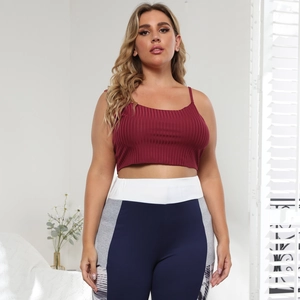 Detail view of the burgundy ribbed crop top paired with high-waisted colorblock leggings