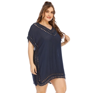 Detail of navy blue crochet lace stitching and V-neckline on the beach cover-up dress