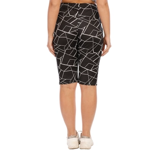 Rear view of high-waisted plus size biker shorts with black and white geometric pattern
