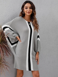 Detail showing grey knit dress texture with black and white color-block stripes