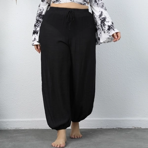 Women's plus size loose black lantern trousers with elastic waist and drawstring hem