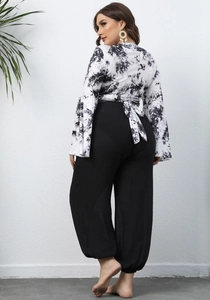 Plus size two piece set with tie-dye wrap top and black high waist wide leg pants