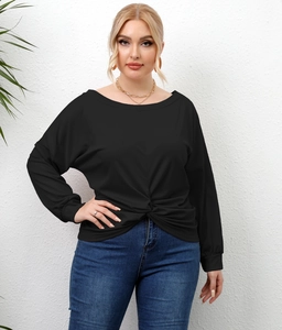 Detail of black plus size tunic top with stylish front knot hem and long sleeves