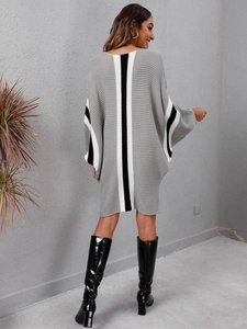 Close-up of the chunky knit texture and contrast striped back on this grey batwing dress