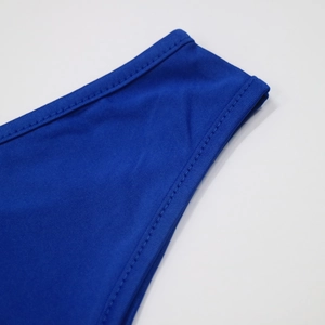 Detail of royal blue elastic fabric with premium stitching on irregular shoulder strap