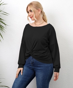 Close-up of the stylish twist-knot hem detail on this black long-sleeve casual t-shirt