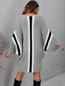Detail view of the chunky knit sweater dress with contrast vertical back stripes and batwing sleeves
