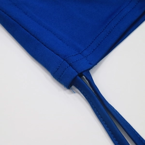 Detailed macro shot of royal blue elastic knit fabric with fine double-stitch sewing