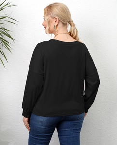 Back view of black long-sleeved casual top with dropped shoulders and ribbed cuffs