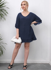Detail of V-neck dark blue beach cover-up dress with ruffled sleeves and lightweight fabric