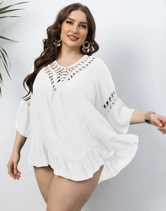 White boho crochet beach cover-up with ruffled hem and hollow embroidery detail