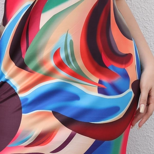 Women's plus size sleeveless maxi dress featuring vibrant colorful abstract print