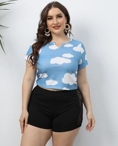 Detail of blue rib-knit crop top with cloud print and lace-up side shorts