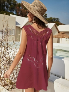 Detail of elegant maroon V-neck crochet patchwork and backless design on beach cover-up dress