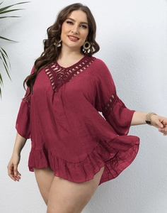 Detail of burgundy plus size beach top with hollow crochet knit and ruffle hem textures
