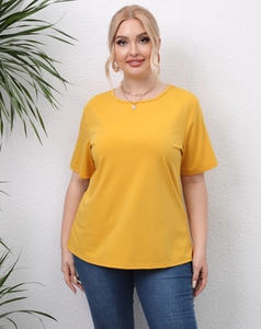 Detail of plus size mustard yellow short sleeve T-shirt with round neck and dropped shoulders