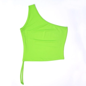 Detail of neon green one-shoulder crop top with adjustable drawstring at the hem