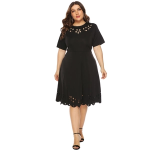 Detail of hollow floral cut-outs and soft fabric on a black short sleeve plus size dress