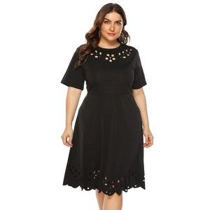 Detailed view of the laser-cut floral hollow pattern on the black plus size dress