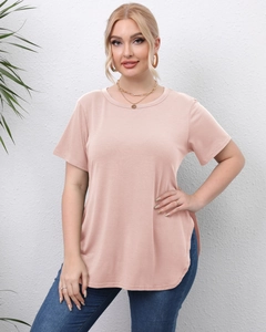 Detail view of pink t-shirt with side split and curved hem on soft knit fabric