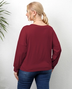 Detail view of burgundy long sleeve t-shirt with drop shoulder and elastic cuff design