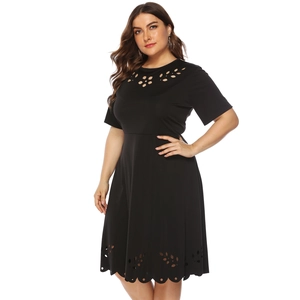 Plus size black dress with laser-cut hollow floral pattern and short sleeves
