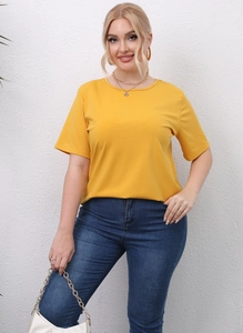 Close-up of a plus-size ginger yellow short-sleeve T-shirt with a classic round neckline