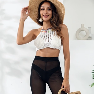 Boho crochet halter top with white lace detail and black mesh trousers beach set for women