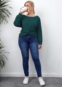 Detail of the knotted hem design on a dark green long-sleeve casual plus-size shirt