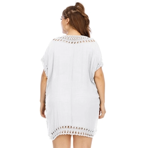 Detailed back view of a white plus-size beach cover-up with intricate geometric crochet lace