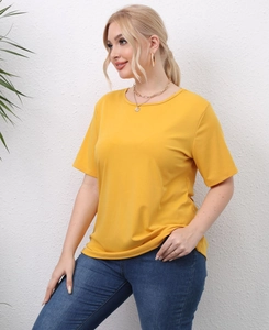 Close-up of mustard yellow plus size t-shirt with cut-out pattern on short sleeves