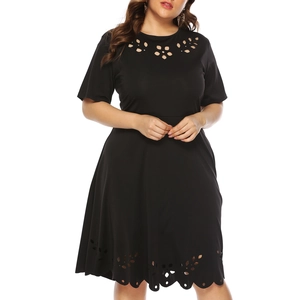 Close-up of laser-cut floral hollow details on the neckline of black plus size dress