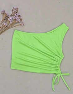 Detail view of the drawstring ruched side on lime green one shoulder crop top shirt