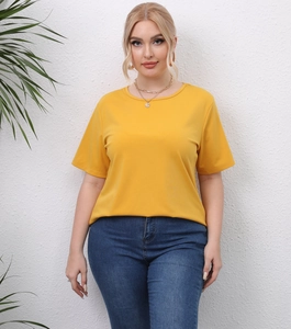 Plus size yellow short sleeve T-shirt with crew neck and casual fit on model