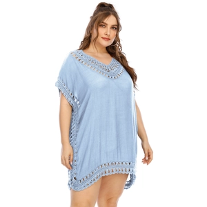 Detailed view of the handcrafted crochet V-neckline on this light blue beach cover-up dress