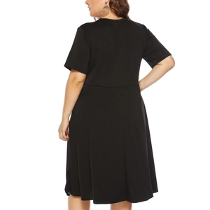 Detail view of the back of a black short-sleeve plus size dress with a defined waistline