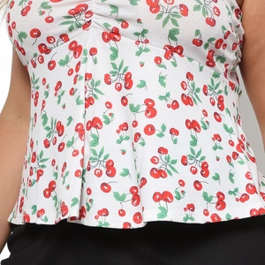 Close-up of white ribbed knit fabric with red cherry print and front drawstring detail