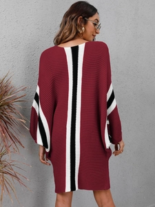 Back view of loose batwing sleeve knit dress with contrasting stripes and ribbed texture