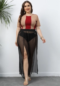 Detail view of high slit black mesh skirt with khaki and wine red striped knit crop top