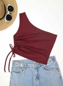Detail of adjustable drawstring ruching on a wine red one-shoulder cropped tank top