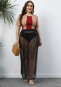 Detail of plus size mesh cover-up skirt with high slit and elastic waist for beachwear
