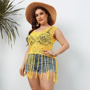 Close-up of vibrant yellow crochet hollow-out knit top featuring long tassel fringe details