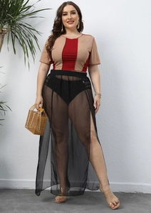 Detail view of plus size black sheer mesh side slit skirt with elastic waist and see-through fabric