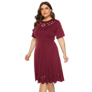 Close-up of laser-cut floral hollow details on burgundy plus size A-line dress