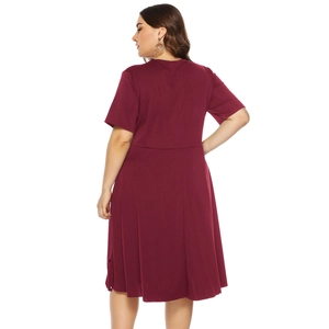 Detail view showing the high waist cut and flowing back of the burgundy short sleeve dress