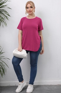 Detail of plus size rose red T-shirt showing round neck and side slit hem on model