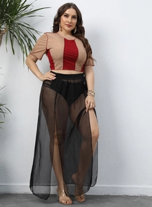 Detail view of the black sheer mesh high-slit skirt and high-waisted briefs for plus size women